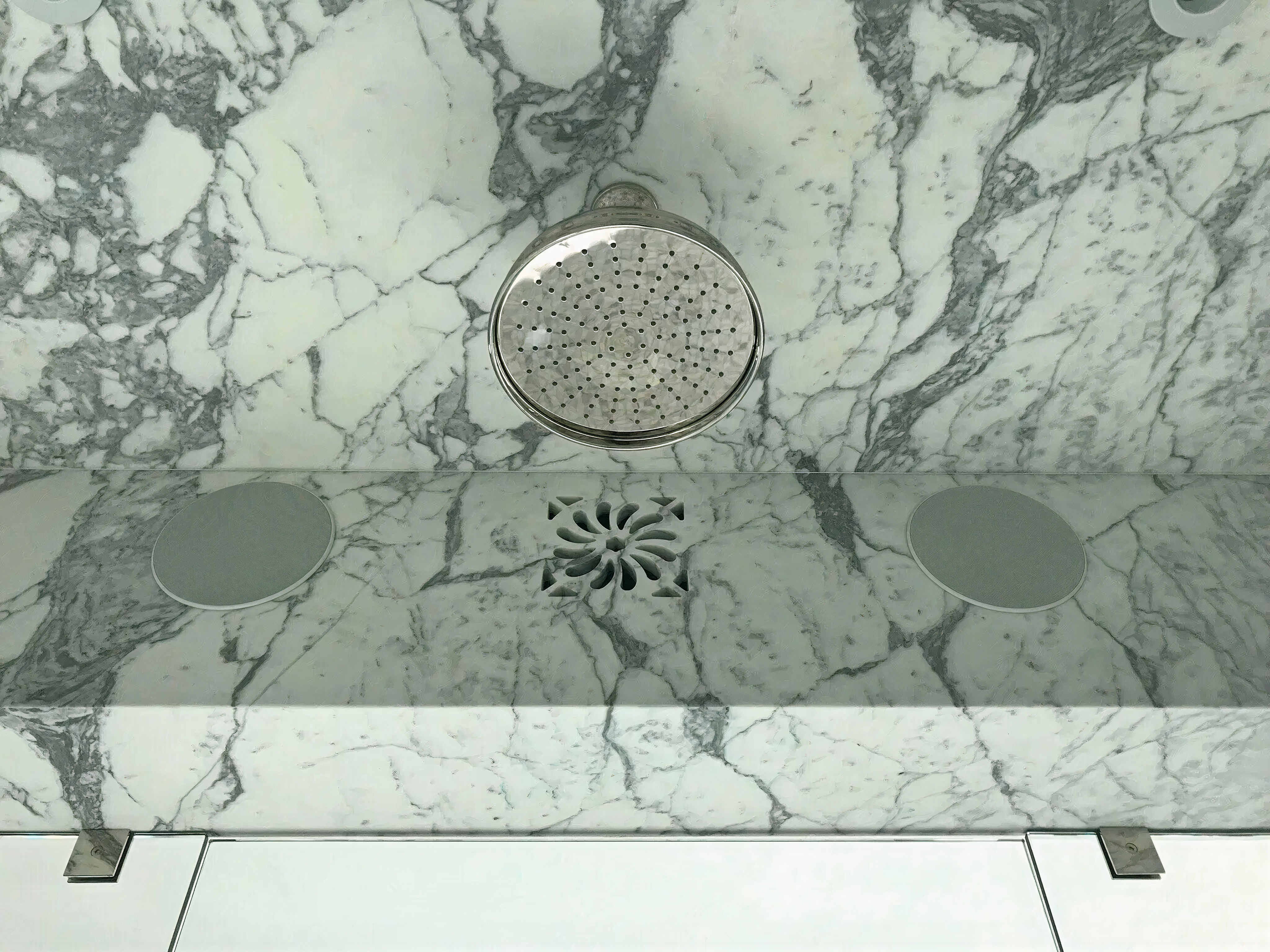 Waterjet-cut design in marble in a bathroom shower